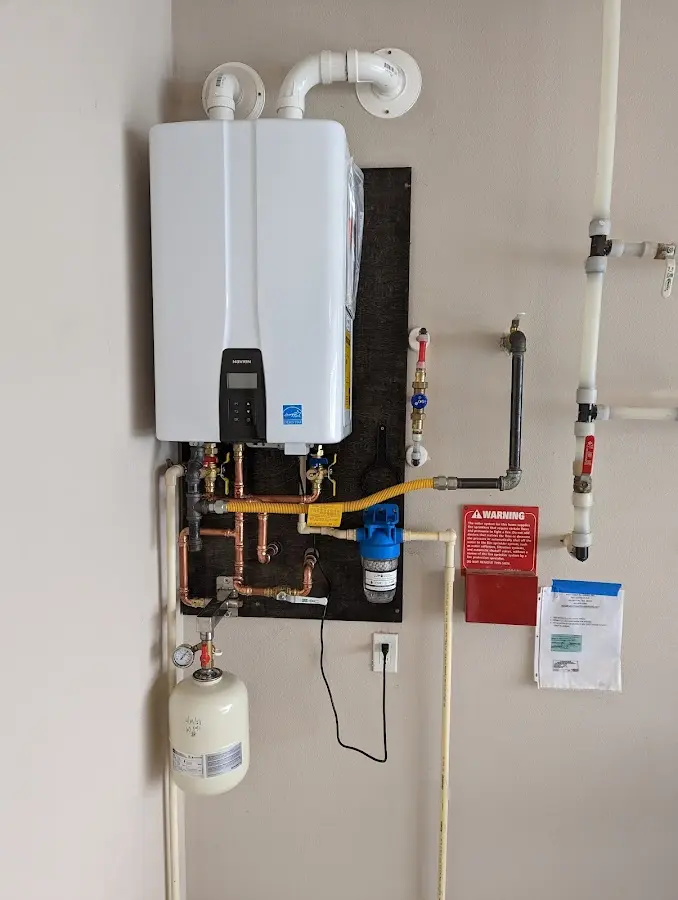 Professional plumber installing copper piping in a Sheldon home